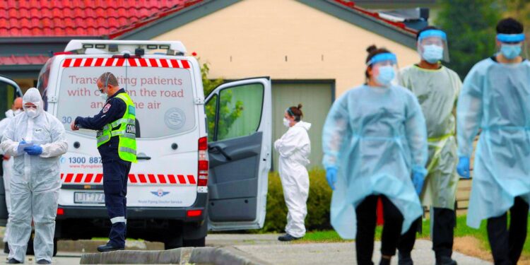 Aged care residents in Fawkner are taken to waiting ambulances after a COVID-19 outbreak. There are fears Victoria’s death toll will rise sharply this week. Picture: David Crosling