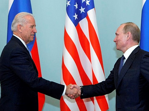 Vice President of the United States Joe Biden, left, shakes hands with Russian Prime Minister Vladimir Putin in Moscow, Russia, Thursday, March 10, 2011. The talks in Moscow are expected to focus on missile defense cooperation and Russia's efforts to join the World Trade Organization. (AP Photo/Alexander Zemlianichenko)