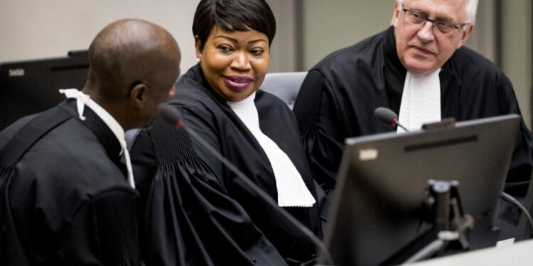 International Criminal Court (ICC) chief prosecutor Fatou Bensouda (C) and deputy prosecutor James Stewart (R) attend the initial appearance before judges of member of the board of the Confederation of African Football (CAF), Patrice-Edouard Ngaissona of the Central African Republic, at the ICC in The Hague on January 25, 2019, following his extradition from France on charges of war crimes and crimes against humanity. Ngaissona is charged with coordinating so-called anti-Balaka militia which emerged after civil war broke out in the Central African Republic (CAR) in 2013. (Photo by Koen van Weel / POOL / AFP) / Netherlands OUT