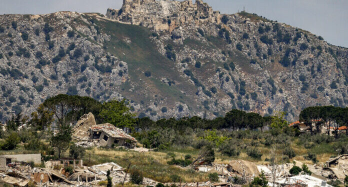 Destroyed buildings are pictured in the village of KfarKila in southern Lebanon as seen from across the border in the Upper Galilee region of northern Israel on May 29, 2026, with the Crusader-period Beaufort Castle pictured in Lebanon in the background. Lebanese and Israeli military delegations were to hold security talks at the Pentagon on May 29, during which Beirut will demand Israel halt its attacks, which have intensified in recent days. The development comes as the US and Hezbollah's backer Iran, were negotiating with Tehran, which insists the fighting in Lebanon must be included in any agreement ending the Middle East war. (Photo by Jalaa MAREY / AFP)