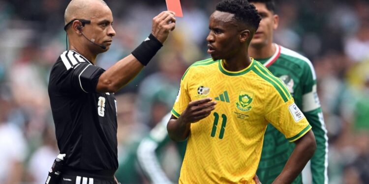 Brazilian referee Wilton Sampaio shows a red card to South Africa's midfielder #11 Themba Zwane during the 2026 World Cup Group A football match between Mexico and South Africa at the Mexico City Stadium in Mexico City on June 11, 2026. (Photo by Yuri CORTEZ / AFP)
