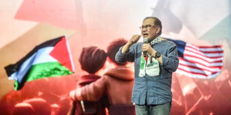 Malaysia's Prime Minister Anwar Ibrahim delivers a speech during a pro-Palestinian rally in Kuala Lumpur on August 4, 2024. (Photo by Arif Kartono / AFP)