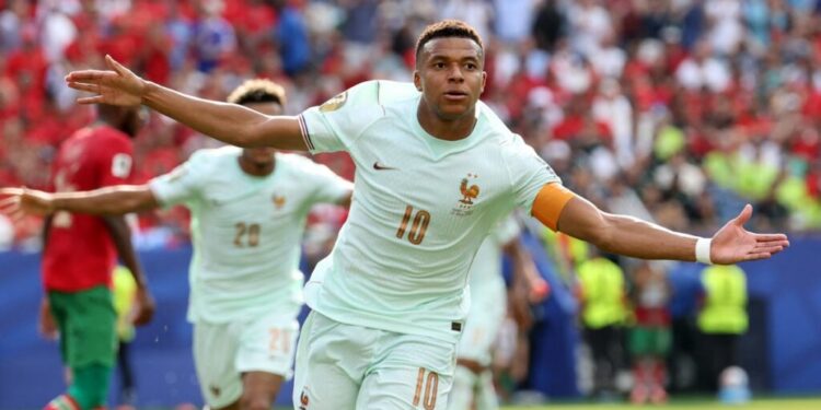 France's forward #10 Kylian Mbappe celebrates scoring his team's first goal during the 2026 World Cup football tournament quarter-final match between France and Morocco at Boston Stadium in Foxborough on July 9, 2026. (Photo by Odd ANDERSEN / AFP)