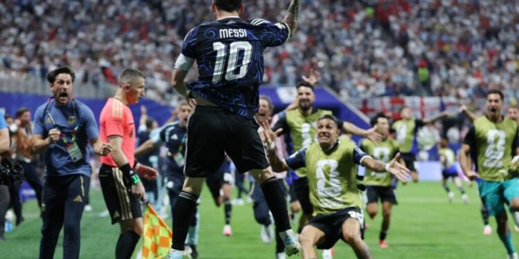 Argentina's forward #10 Lionel Messi celebrates his team's second goal scored by Argentina's forward #22 Lautaro Martinez (out of frame) during the 2026 World Cup football tournament semi-final match between England and Argentina at the Atlanta Stadium in Atlanta on July 15, 2026.  (Photo by Thomas COEX / AFP)